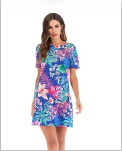 Close-up of short sleeve floral dress featuring vibrant tropical leaf and flower patterns