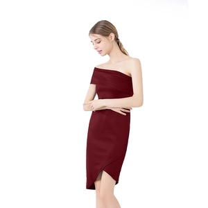 Detail of burgundy one-shoulder cocktail dress featuring asymmetric hem and slim fit