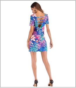 Detail view of tropical floral dress featuring a hollow-out back design with three straps