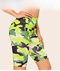Close-up of high-waisted camo print yoga shorts featuring neon yellow and green patterns