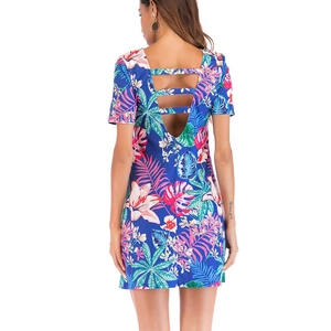 Royal blue short sleeve floral dress featuring a stylish triple-strap backless cutout