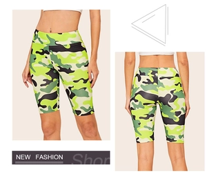 Front and back view of women high waist camo yoga shorts in vibrant green and black pattern
