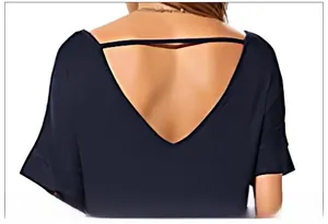 Detail view of women's black V-back short sleeve dress showing the elegant open back design