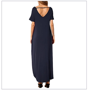 Detail of navy blue maxi dress featuring a deep V-back design and soft knitted fabric