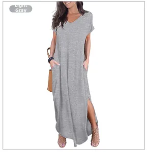 Detail of light grey V-neck dress featuring practical side pockets and a subtle side slit
