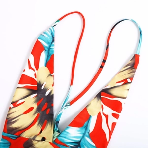 Floral print V-neck strap dress with tropical pattern and vibrant red backless design