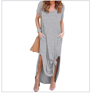 Detail of grey V-neck maxi dress featuring side slits and functional side pockets