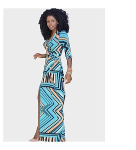 Detail of V-neck wrap dress featuring geometric print and side slit in summer fabric