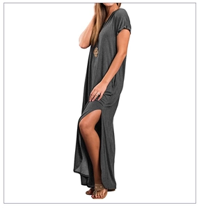 Detail view of the high side slit on a charcoal gray short sleeve maxi casual dress