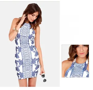 Close-up of blue floral print detail and texture on backless halter neck mini dress
