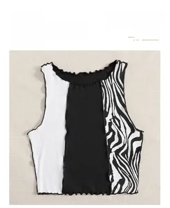 Detail of color-block knit crop top showing zebra print and lettuce edge hem