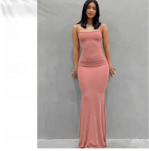 Detailed view of the pink sleeveless bodycon knit dress with a flared fishtail hemline