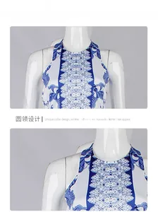 Detailed close-up of halter neckline and symmetric blue bohemian print on summer dress