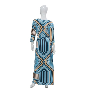 Back view of women's V-neck maxi dress featuring colorful geometric prints and waist belt