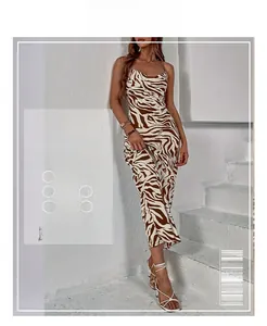 Detailed view of backless zebra print slip dress with thin straps and sleek fabric