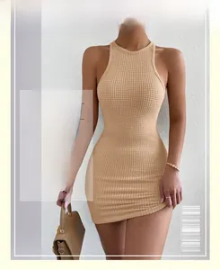 Detail shot of beige waffle knit texture on a slim fit sleeveless mini dress