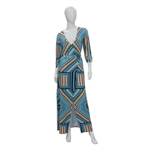 Slim fit V-neck dress with geometric print and side slit on a white mannequin
