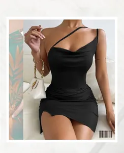 Detail shot of black bodycon mini dress featuring asymmetric neckline and side rushing