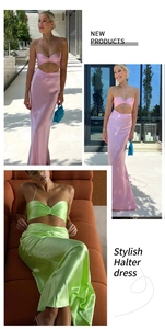 Detail of satin two-piece halter crop top and high-waist maxi skirt in glossy finish