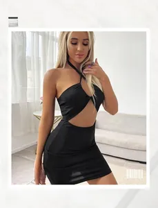 Detailed view of black halter neck cutout dress with ribbed texture and slim fit