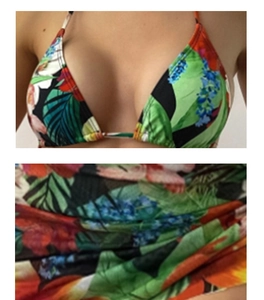 Detail of tropical palm leaf and floral print on bikini top and bottom set