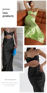 Detail of satin two-piece set featuring pleated crop top and long flowing skirt