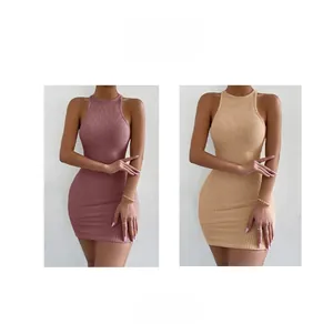 Detail view of waffle knit mini dress fabric in dusty rose and light apricot colors
