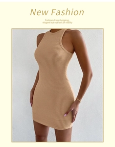Close-up of beige sleeveless knitted dress showing premium waffle texture and slim fit
