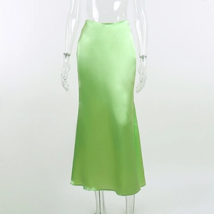 Detailed view of light green satin maxi dress showing silk-like texture and high waist design
