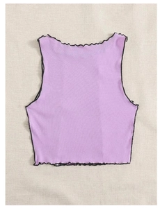 Detailed close-up of lavender knit crop top with contrasting black lettuce trim edges