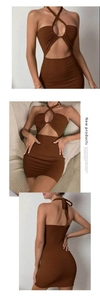 Detail of a brown halter hollow-out knit dress showing ribbed fabric and backless design