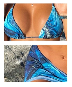 Detail shot of bikini top and bottom featuring blue and black marble print fabric
