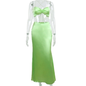 Elegant two-piece green satin set with cropped camisole top and high waist maxi skirt