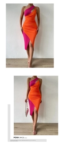 Detail of knit ribbed fabric on orange and pink one-shoulder midi dress with cut-out