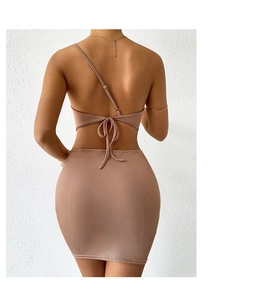 Detail of the back cross-tie bow design on a knitted off-shoulder backless dress