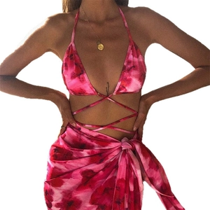 Three-piece pink tie-dye bikini set with matching floral sarong for beach vacation wear