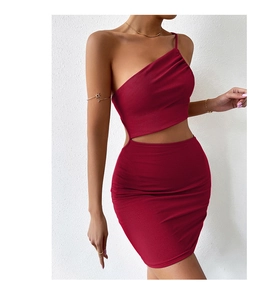 Detailed view of dark red rib-knit texture and waist cutout design on a bodycon dress