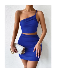 Detail view of royal blue one-shoulder ribbed knit crop top and bodycon mini skirt