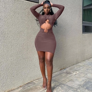 Slim fit long sleeve mini dress in brown with side cut-outs and metal ball rings