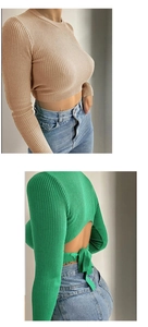 Detail view of the vertical ribbed texture and open back lace-up design of the crop top