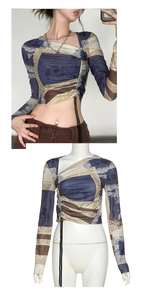 Detail of printed off-shoulder top with vintage pattern and side drawstring adjustment
