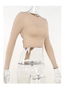 Detail showing the ribbed knit texture and back lace-up design of the beige crop top
