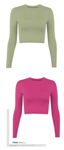 Close-up of ribbed knit texture on long-sleeve crop tops in green and rose pink colors