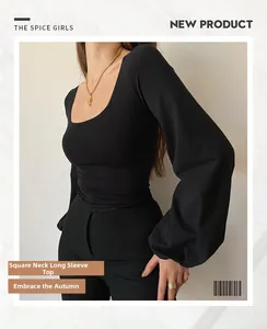 Detail of black long-sleeve top showing slim fit bodice and puffed lantern sleeves