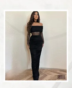 Detail view of the off-shoulder mesh sleeves and ruched texture on the black evening dress