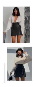 Détail d'une mini-jupe taille haute en cuir PU noir avec double fermeture éclair frontale