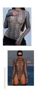 Detail of sheer long sleeve bodysuit with letter print and high cut leg styling