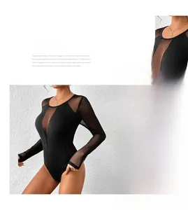 Detail of sheer mesh patchwork on a sexy black long sleeve bodysuit for women
