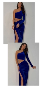 Detail of navy blue velvet one-shoulder evening dress with waist cutout and high slit