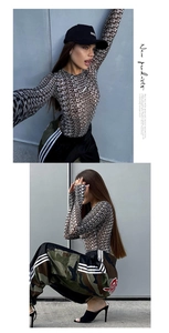 Detail of sheer mesh bodysuit with all-over black letter prints and long sleeves